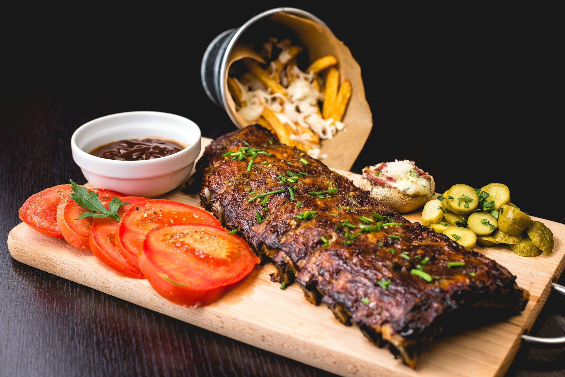 Plate of ribs with tomatoes 